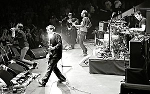 Suede performing at the Royal Albert Hall, March 2010 From left to right: Brett Anderson, Richard Oakes, Neil Codling, Mat Osman and Simon Gilbert.