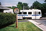 A southbound MTA Light Rail train passes the old B&A Linthicum Heights station at Maple Road in August 2009