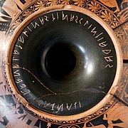 Etruscan inscription to the Dioskouroi as "sons of Zeus" at the bottom of an Attic red-figure kylix (c. 515–510 BC)