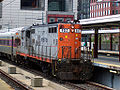 An MBTA GP9 locomotive making a non-revenue move into South Station in Boston, Massachusetts. This locomotive was retired by the MBTA in 2004 and is now on static display at the Illinois Railway Museum as of September 2014.