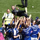 Kieran McKenna is thrown into the air by his Ipswich Town players after leading the team to back-to-back promotions in May 2024