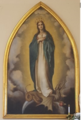 The large oil painting of the Blessed Virgin was painted over 100 years ago by Sacred Heart nun, Mother Mary Zahel. A school pupil, Rita de Lange was used to pose for the face. The painting has adorned both churches.