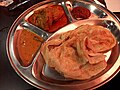 Roti canai with curry chicken in New Zealand