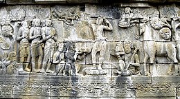 Old stone carving of the Buddha with his servants and horse