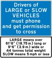 Information sign for very large vehicles to phone before crossing railway