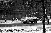 UNPROFOR armoured personnel carrier passes the Presidency building.