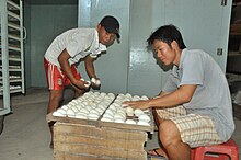 Inspecting duck eggs at a hatchery, Vietnam, 2014