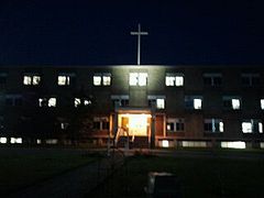 RMC at night, with new cross replacing bell tower.