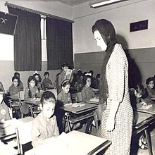 A photograph of one of Faisal's wives, Iffat Al Thunayan, visiting a school