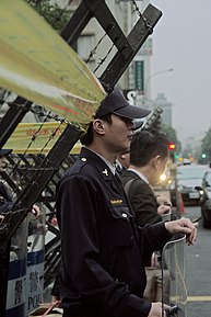 A police officer stands guard