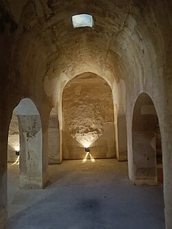 a vaulted room with arches to each side