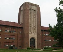 A large rectangular bell tower protruding from a building