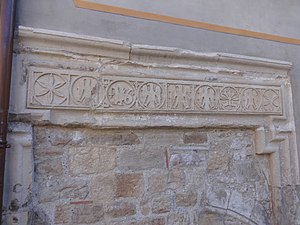 The delicately carved lintel of the same building