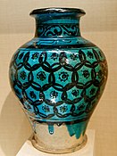 Ayyubid Raqqa ware stoneware glazed jar with overlapping circles grid pattern. Syria, 12th/13th century