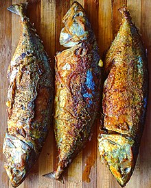 Indian mackerel deep fried with salt and turmeric in mustard oil.
