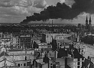 burning Brabag factory in Magdeburg, hit by Allied bombing, January 1945