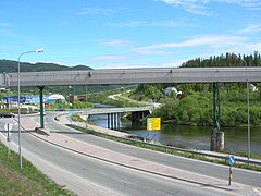 Revelelva on right side of the E6, continuing on right side under the bridge of E12 towards Sweden