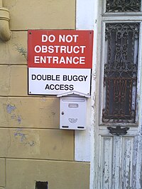 "DO NOT OBSTRUCT ENTRANCE. DOUBLE BUGGY ACCESS."