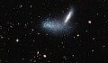 Irregular dwarf galaxy PGC 16389 covers its neighboring galaxy APMBGC 252+125-117.[17]