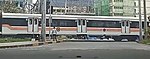 An 8300 class coach at Dela Rosa crossing