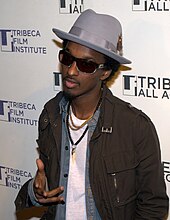 K'naan taking a photo at Tribeca Film Festival in 2010