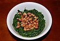 Boiled Kalimeris indica leaves served with salted peanuts