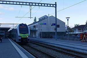 Train pulls in to station with two side platforms