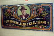 Fileteado-style portrait of Carlos Gardel located opposite the ticket counter