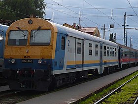 Prototype control car MÁV BDt 405 in its original, grey-yellow-blue livery (now repainted to the fleet color visible on the carriage behind)