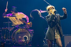 Members of Paramore performing onstage