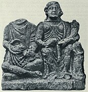 Front of a relief from Saintes, Charente-Maritime. To the left is Cernunnos with purse and torc, to the right is Abundantia with cornucopia.[19]: no 16 