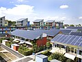 Short terraces of houses, with their entire sloping roofs covered with solar panels