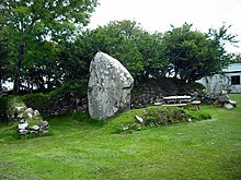 House built with standing stone as wall