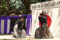 Uehara Eriko sōke (15th headmaster) demonstrating short sword technique with Yamamoto Takahiro shihan (master instructor) - Photo by Hyōhō Taisha-ryū Ryūsenkan