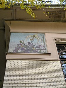 Facade mosaics of Iris flowers against blue sky