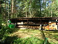 Beehive on the edge of a wood with (from left to right): modern plastic boxes, Kanitz baskets, a Lüneburg Skep and wooden box