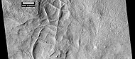 Network of ridges, as seen by HiRISE under HiWish program. Ridges may be formed in various ways.