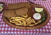 Karađorđeva šnicla with fries, tartar sauce, and a slice of lemon