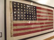 The U.S. flag that flew on the battleship USS Arizona when it sank during the Pearl Harbor. The flag is on display in the first floor of the Arizona State Capitol Museum.