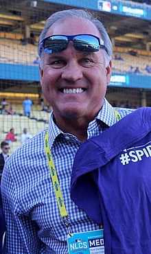 A man in a blue and white checked shirt