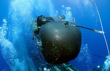 A member of SEAL Delivery Vehicle Team Two prepares to launch one of the team's SEAL Delivery Vehicles from the back of USS Philadelphia on a training exercise. The SDVs are used to carry Navy SEALs from a submerged submarine to enemy targets while staying underwater and undetected.