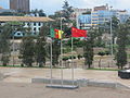 Cameroonian and Chinese flags flying in front of the Sports Palace