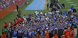 Players and cheerleaders standing together after a game