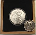 Image 12An American Silver Eagle minted in 2019 (left), an example of a Bullion coin. Its obverse design is based on the older, formerly circulating silver Walking Liberty half dollar (right). (from Coin)