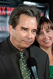 Beau Bridges in a suit with a green tie