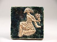 Tile with decor of sitting girl with mirror (1955)