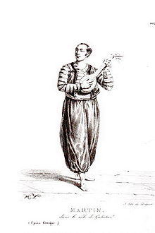 Lithographie en pied d'un acteur célèbre en tenue de scène de la troupe du Théâtre Favart.