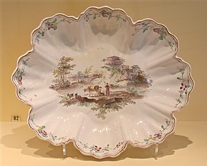 Oblong dish in the shape of a shell with a scalloped edge