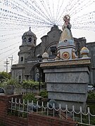 Nuestra Señora de los Desamparados in front of the OLA Church.