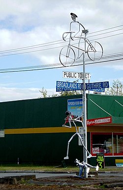 Road sign and sculpture